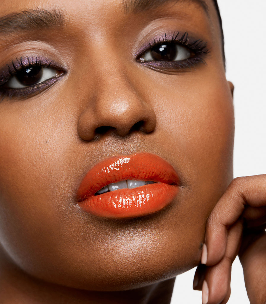 model wearing serum balm intense in sun flare 